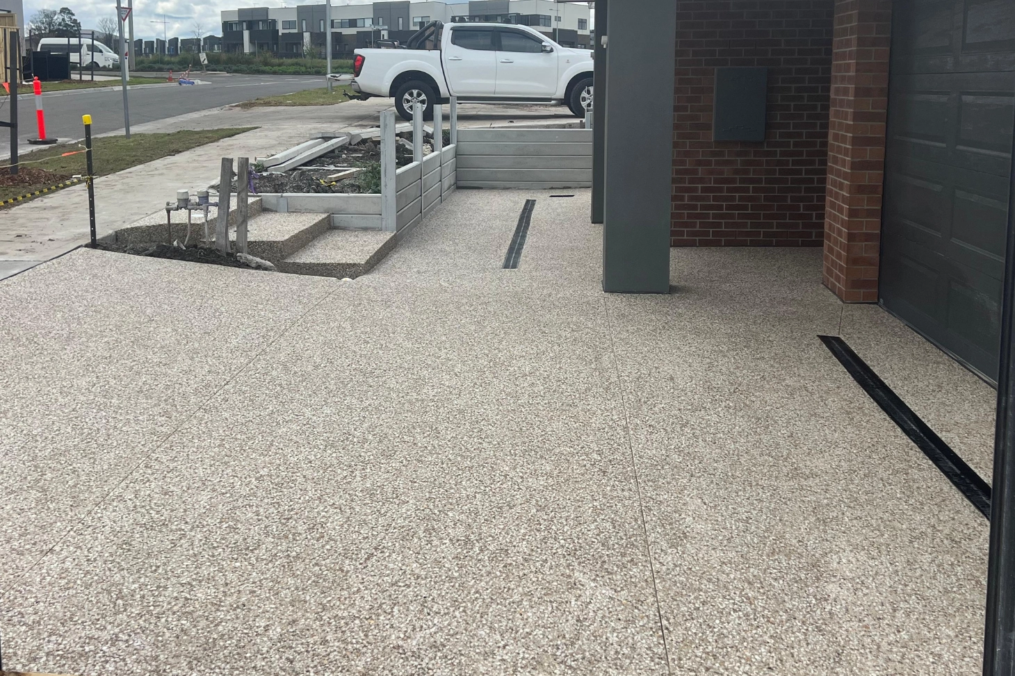 Textured, slip-resistant exposed aggregate surface showing the natural stones