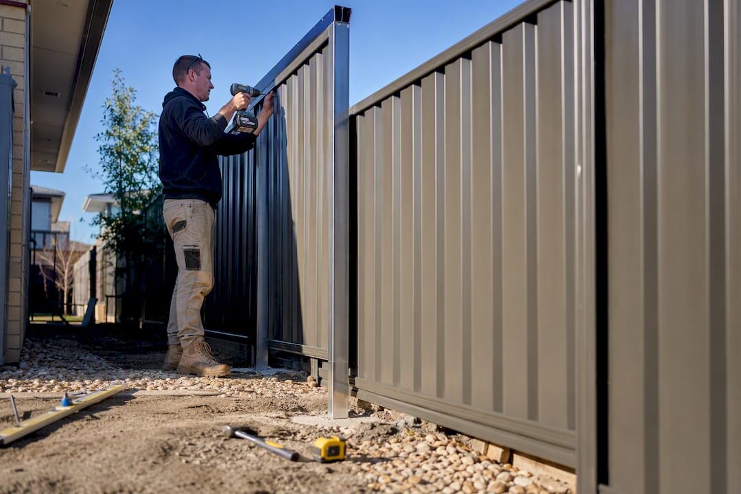 Partial Colorbond fence installation close-up