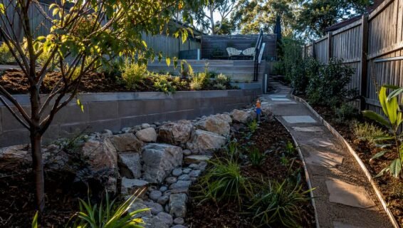 Landscaped backyard with terraced slope solutions